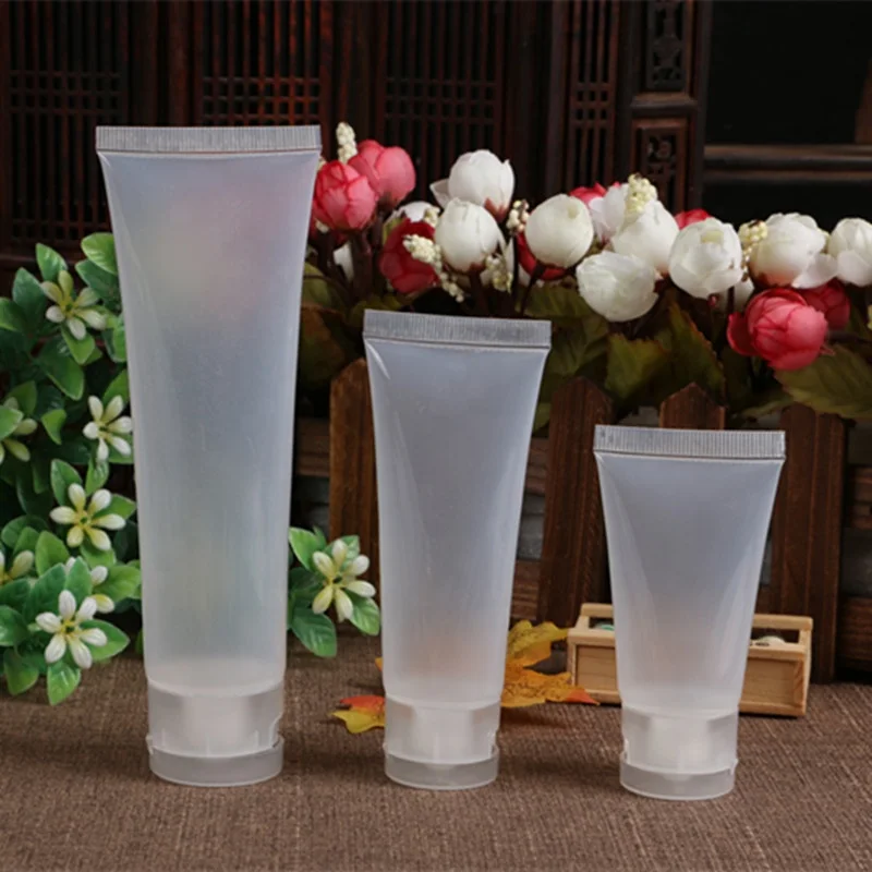 Empty 20ml 30ml 50ml 100ml transparent plastic tube flip top face wash cream soft tubes for cosmetic packaging
