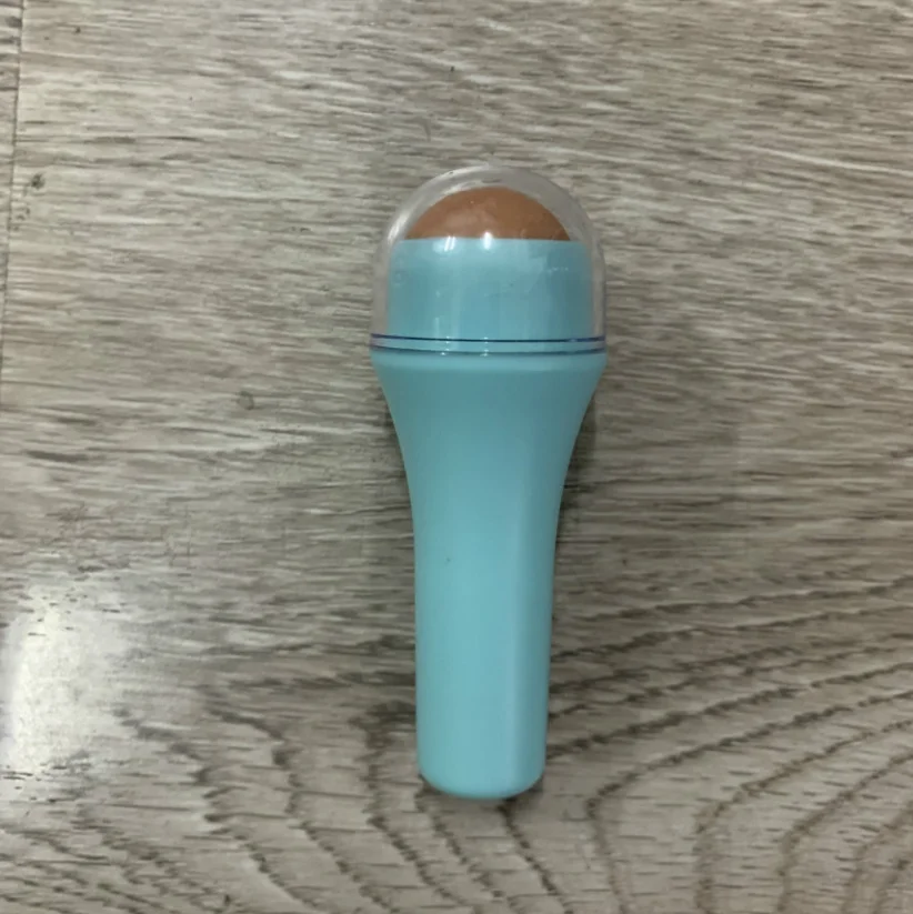 Hot selling high quality natural volcanic stone oil absorption roller facial massage clean skin care tool