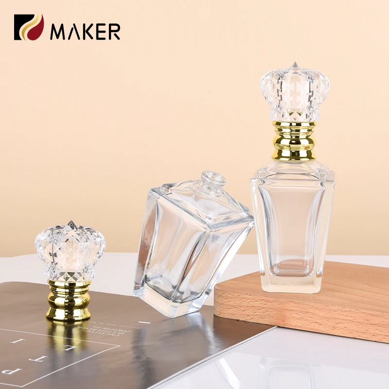 Custom made luxury 60 ml clear glass perfume bottles 60ml clear empty irregular glass parfum spray bottle with crown shaped lids