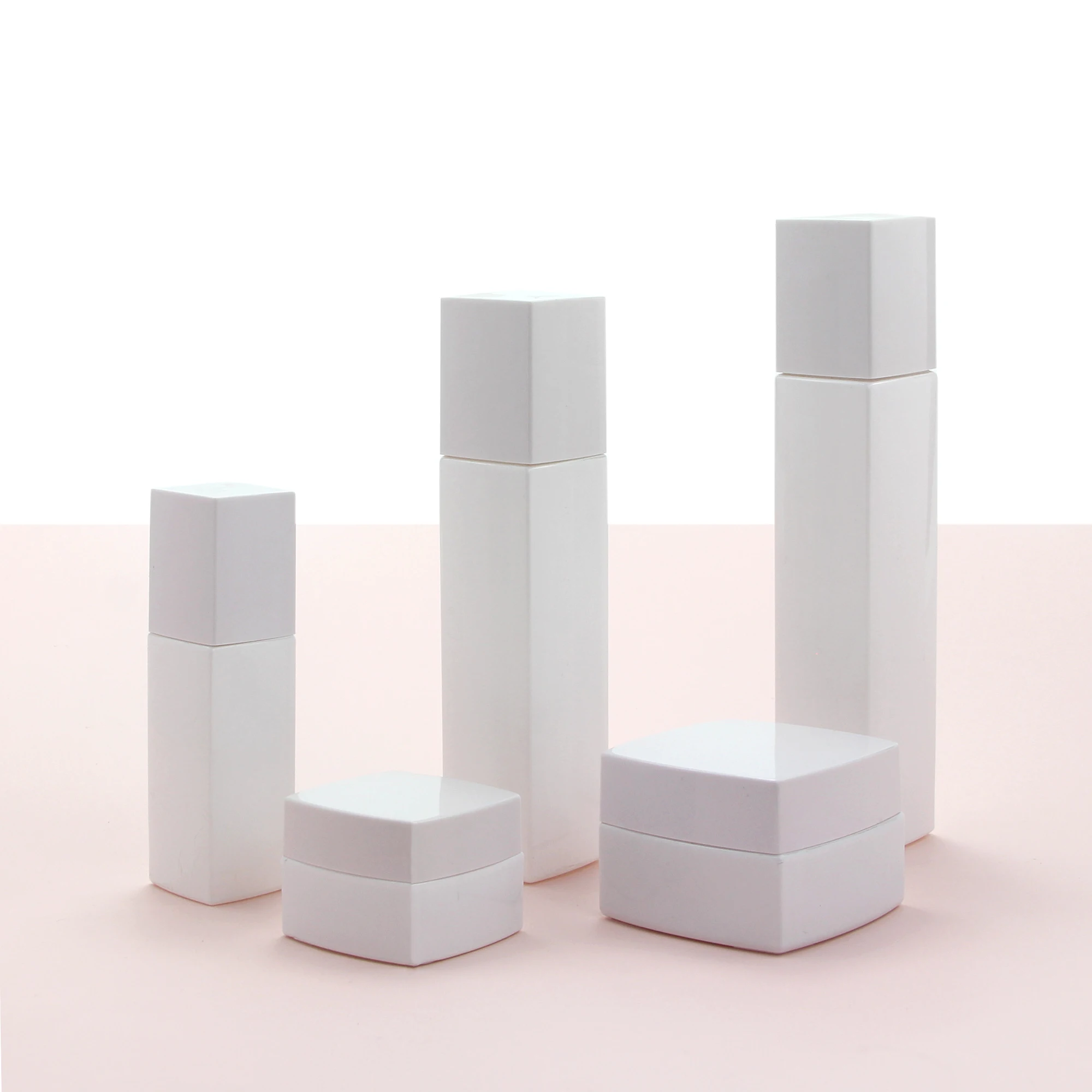 Wholesale cosmetic packaging set square matte pink empty body oil serum pump bottle and glass jars with lids