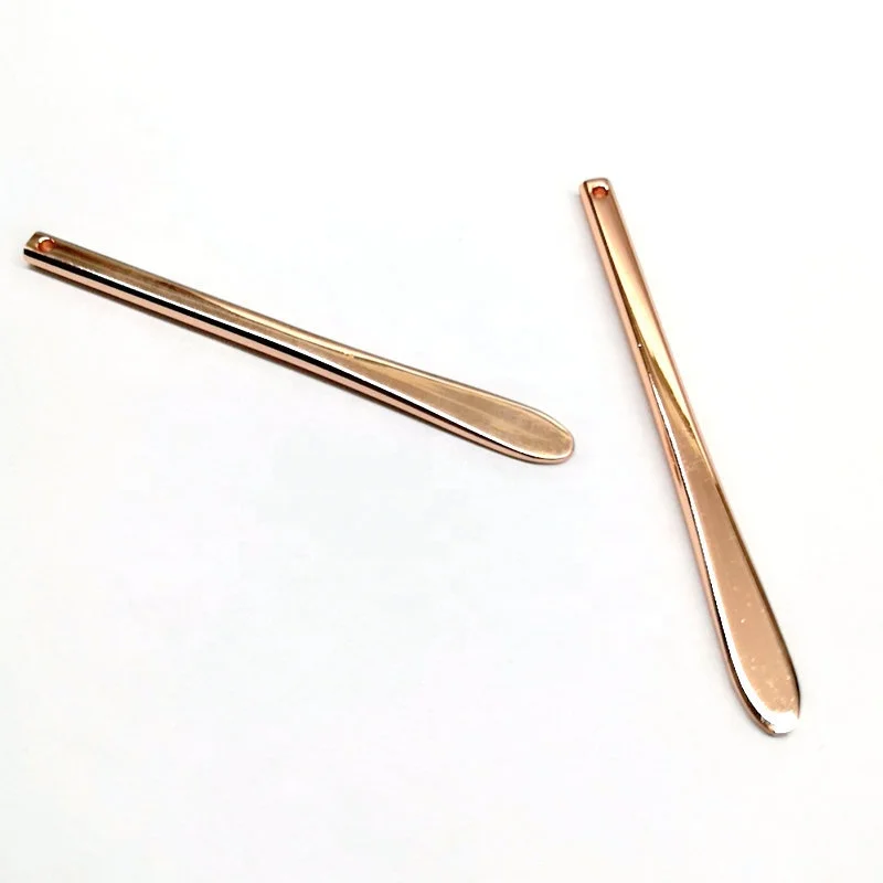 Luxury golden metal spatula in cosmetic along with skincare cream jars