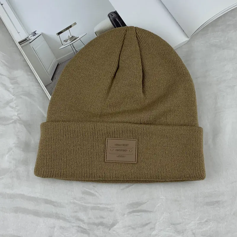 Hengxing high quality winter solid color unisex beanie cap patch logo cuffed custom beanie hats acrylic knit beanie