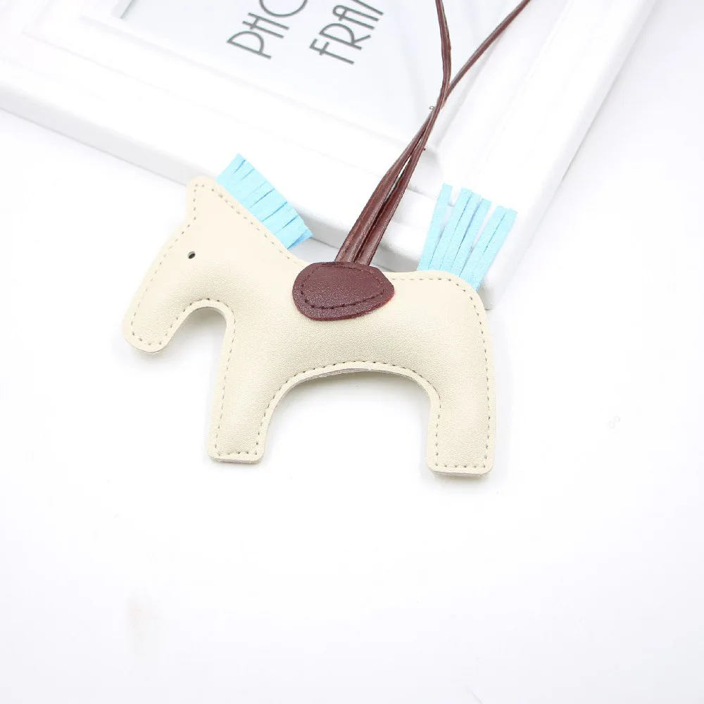 Hot selling cotton filled horse multi-color tassel pendant PU leather keychain hanging rope horse cute fashion bag accessories