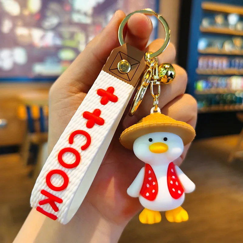 Wholesale cartoon cute funny duck soft rubber pvc keychain girl schoolbag pendant crystal key chains