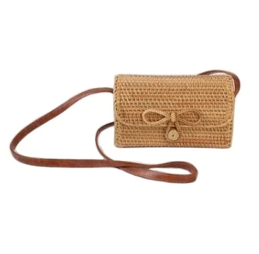 
hot selling high quality handmade woven bowknot closure straw rattan bag custom leather handle rattan shoulder beach bag 