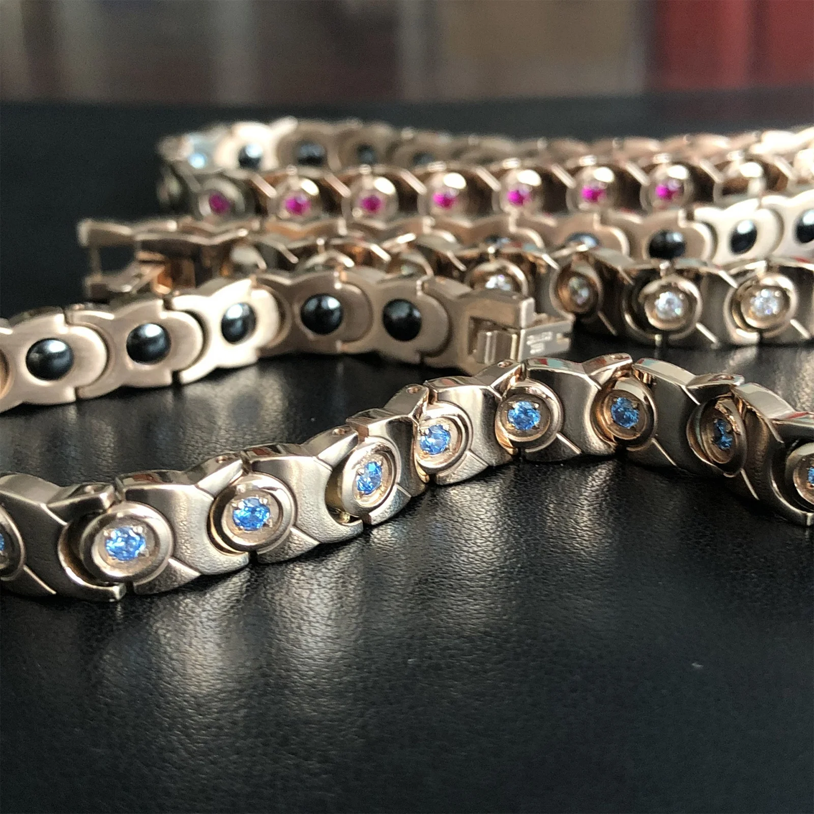 
9112 Womens fashion trendy 2021 rose gold charm bracelets blue diamond key chains bangle black magnet gall stone hand chain OEM 