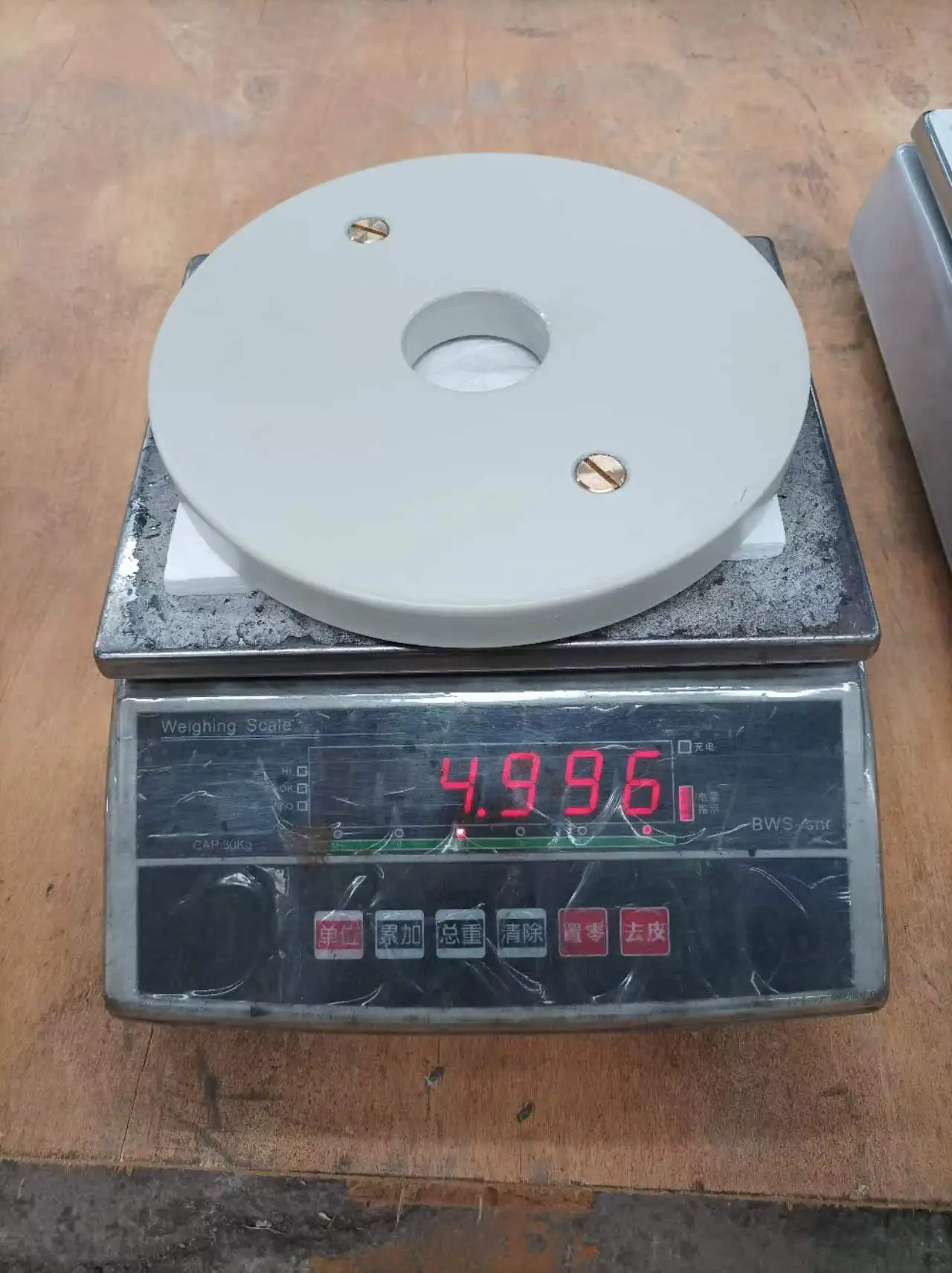 Calibrated steel power lifting barbell weight plates