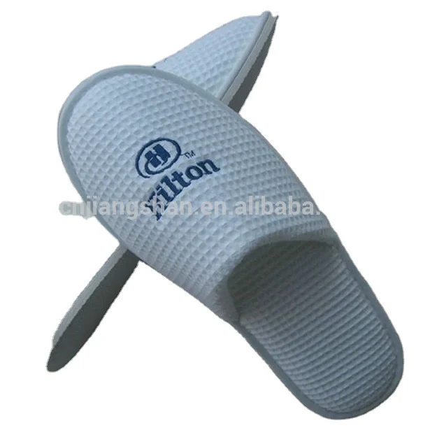 Yangzhou manufactures hot selling hotel slippers with price list