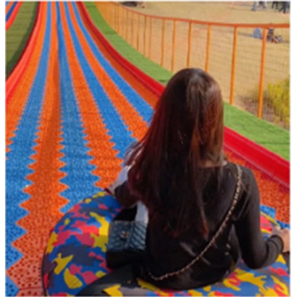 Commercial Rainbow Slide Artificial Ski Grass Turf Surface Donut Slide Ride Dry Slide Slope For Adult