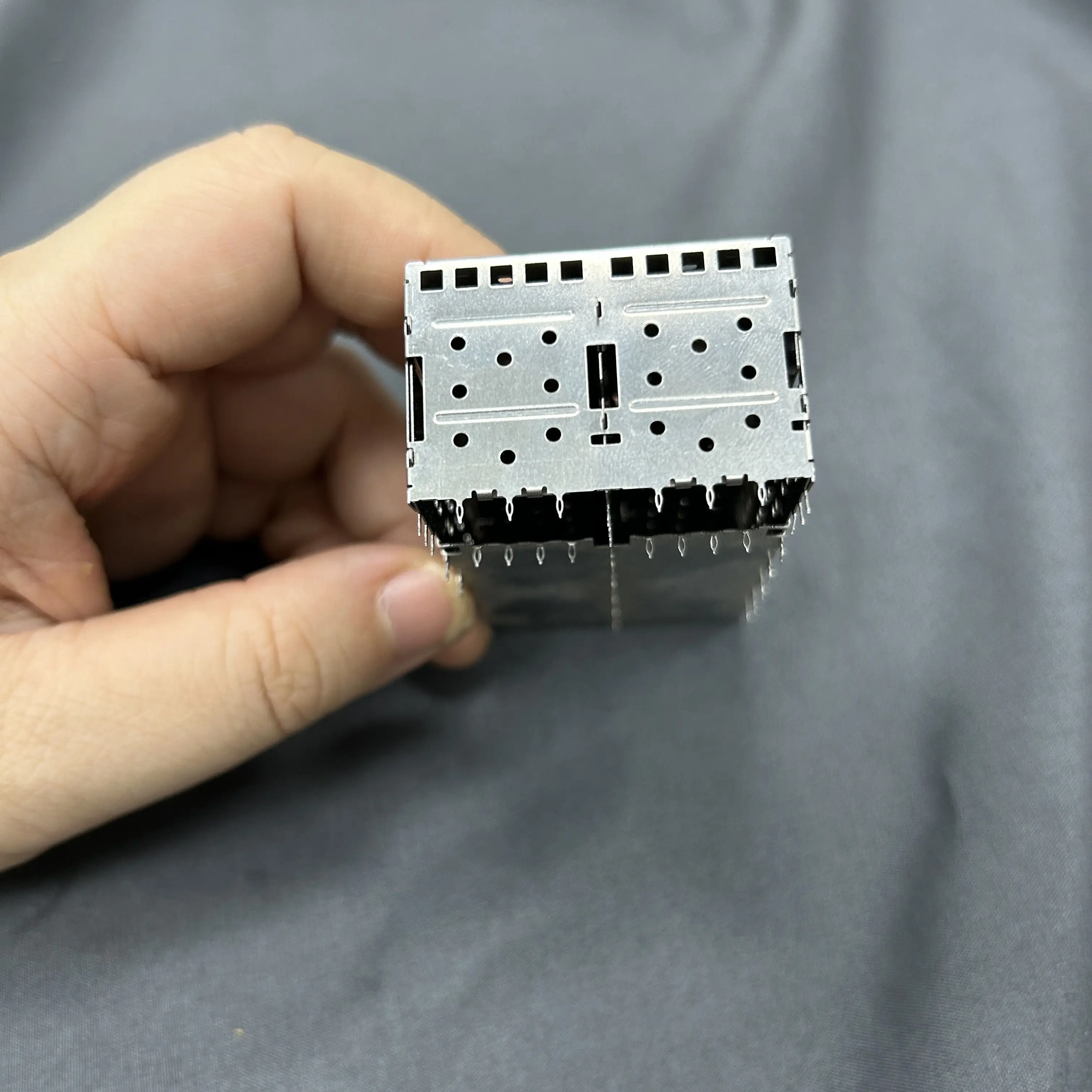 Optical fiber connector module shield cover The optical fiber module has a seat son shield Metal shield crimp pin connector