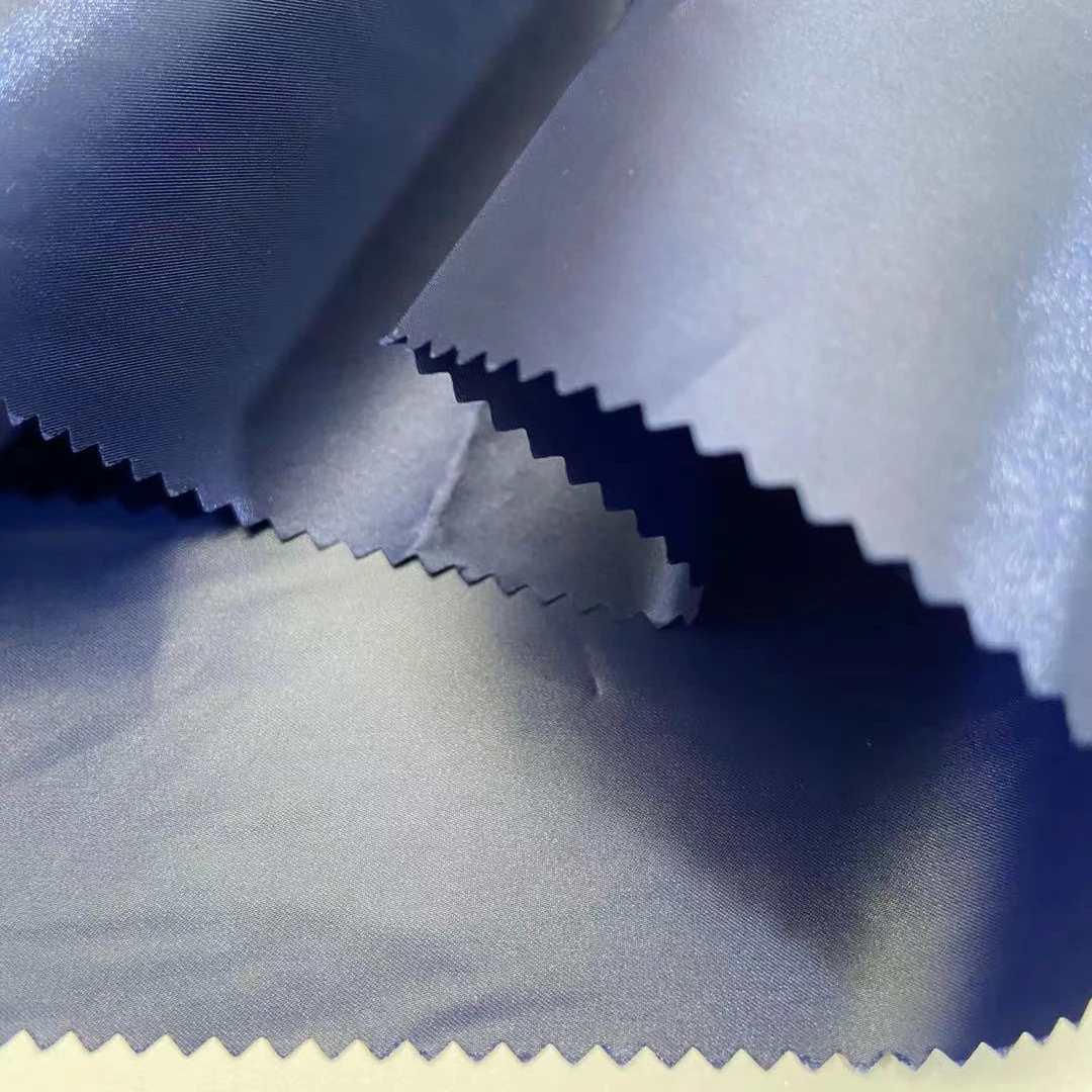 
Wholesale 60% Polyester 40% Nylon 2-Tone Bright Twill 45gsm Down-proof Windproof Lightweight Polyester Fabric With Shiny Yarn 