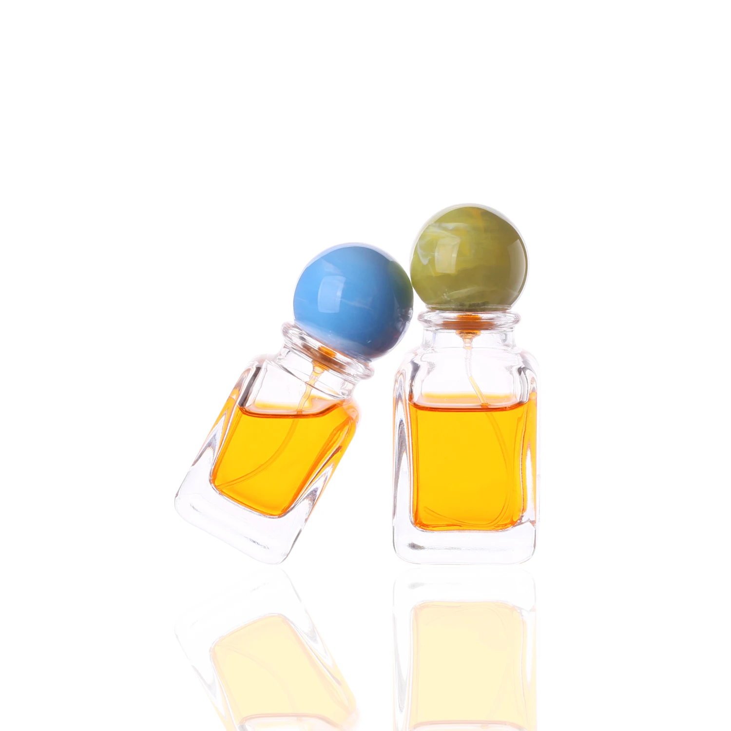 Hot Sale Wholesale Square Unique Shaped 30ml 50ml 100ml  Glass Perfume Bottles with Customized Colored Resin Ball Lids