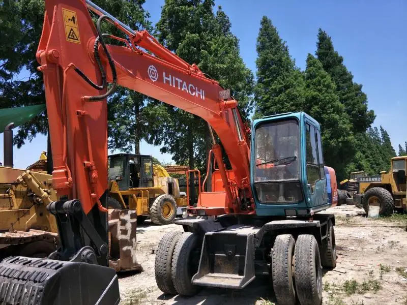 Японский колесный экскаватор HITA CHI EX100WD