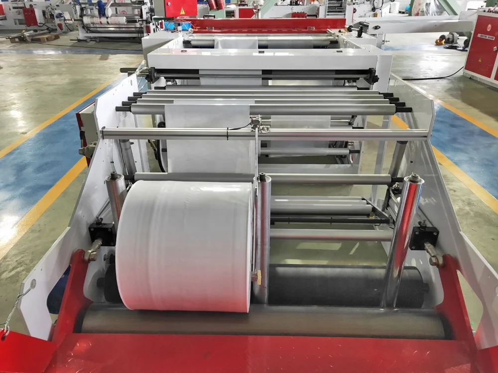 
fully automatic heavy duty flying knife cutting bottom sealing bag making machine price 