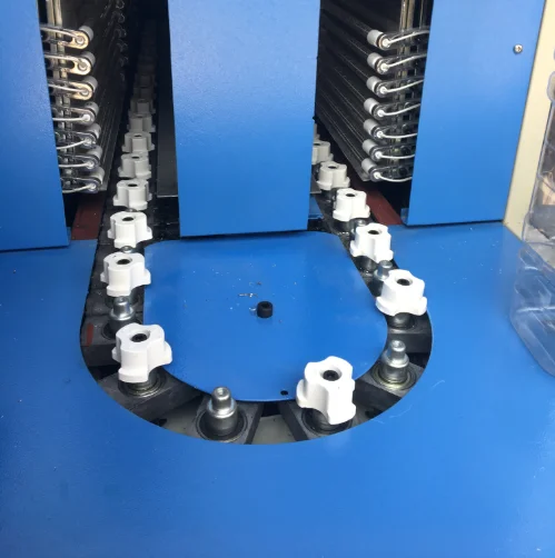 Preform holder seat for semi-automatic bottle blowing machine oven