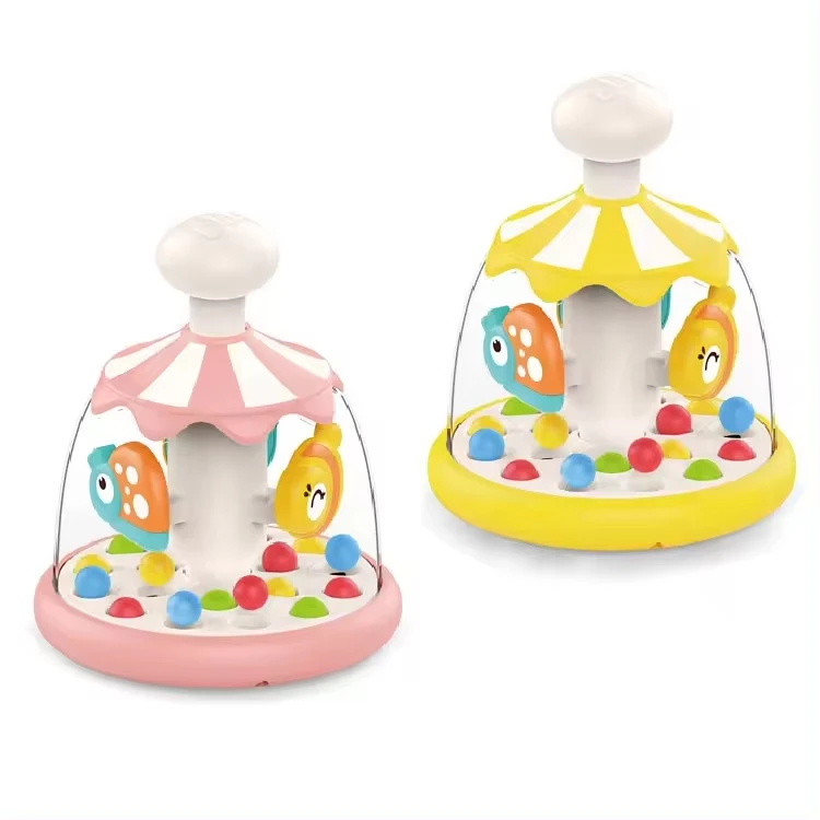 Children hand pressing bouncing ball game education toy tumble carousel toys for baby