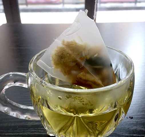 Disposable triangle nylon pyramid tea bags wholesale price tea bag with custom string