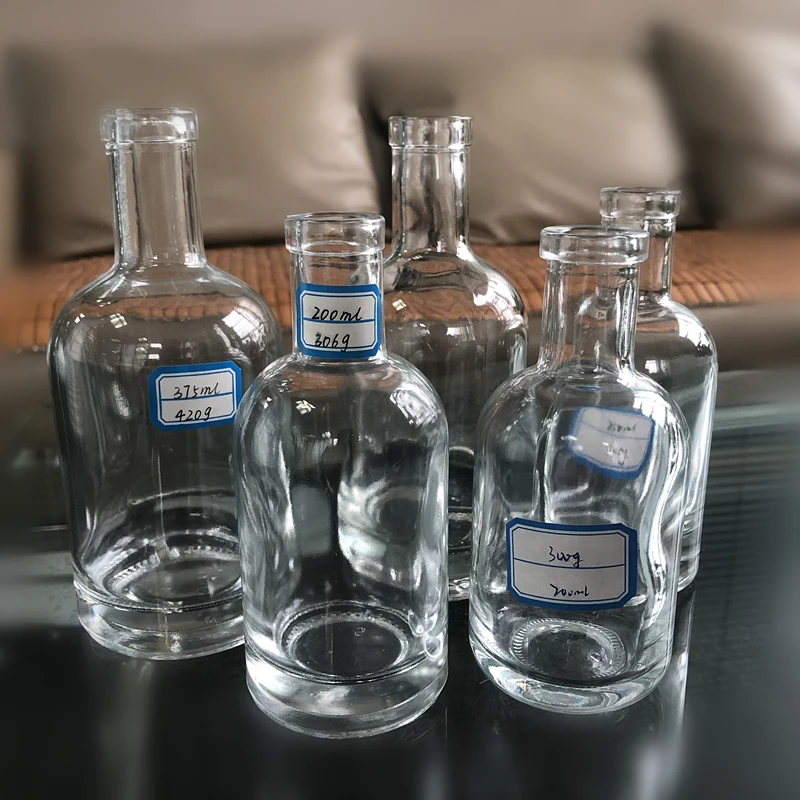 Hot selling free samples transparent frosted 100 ml glass vodka bottle reusable customized glass bottle for vodka