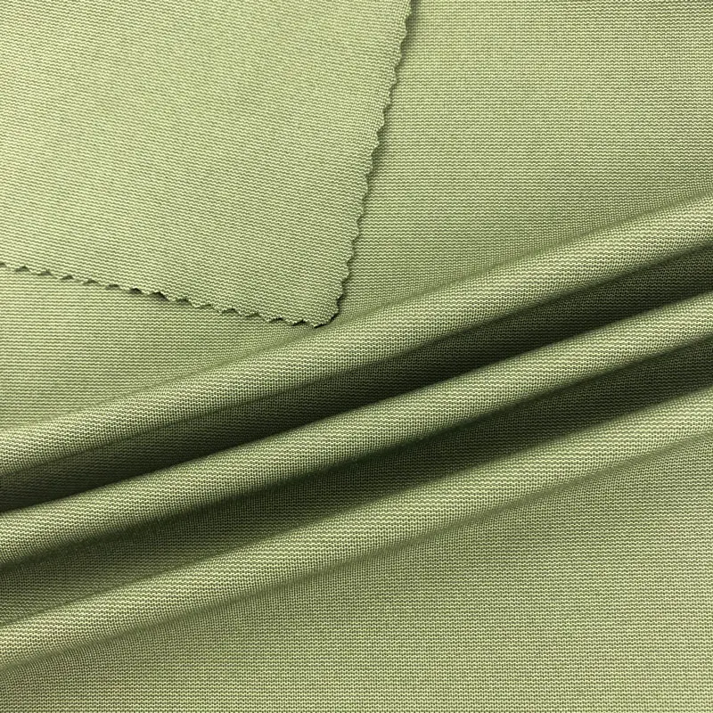 High elastic plain knit single side fabric dry fit wicking  bamboo charcoal spandex ployetser fabric for sports jersey garments
