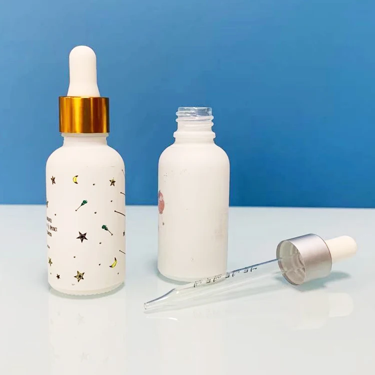 Hot sale luxury custom 10Ml 30ml frosted matte white cosmetic glass serum essential oil bottle with gold dropper and paper tube