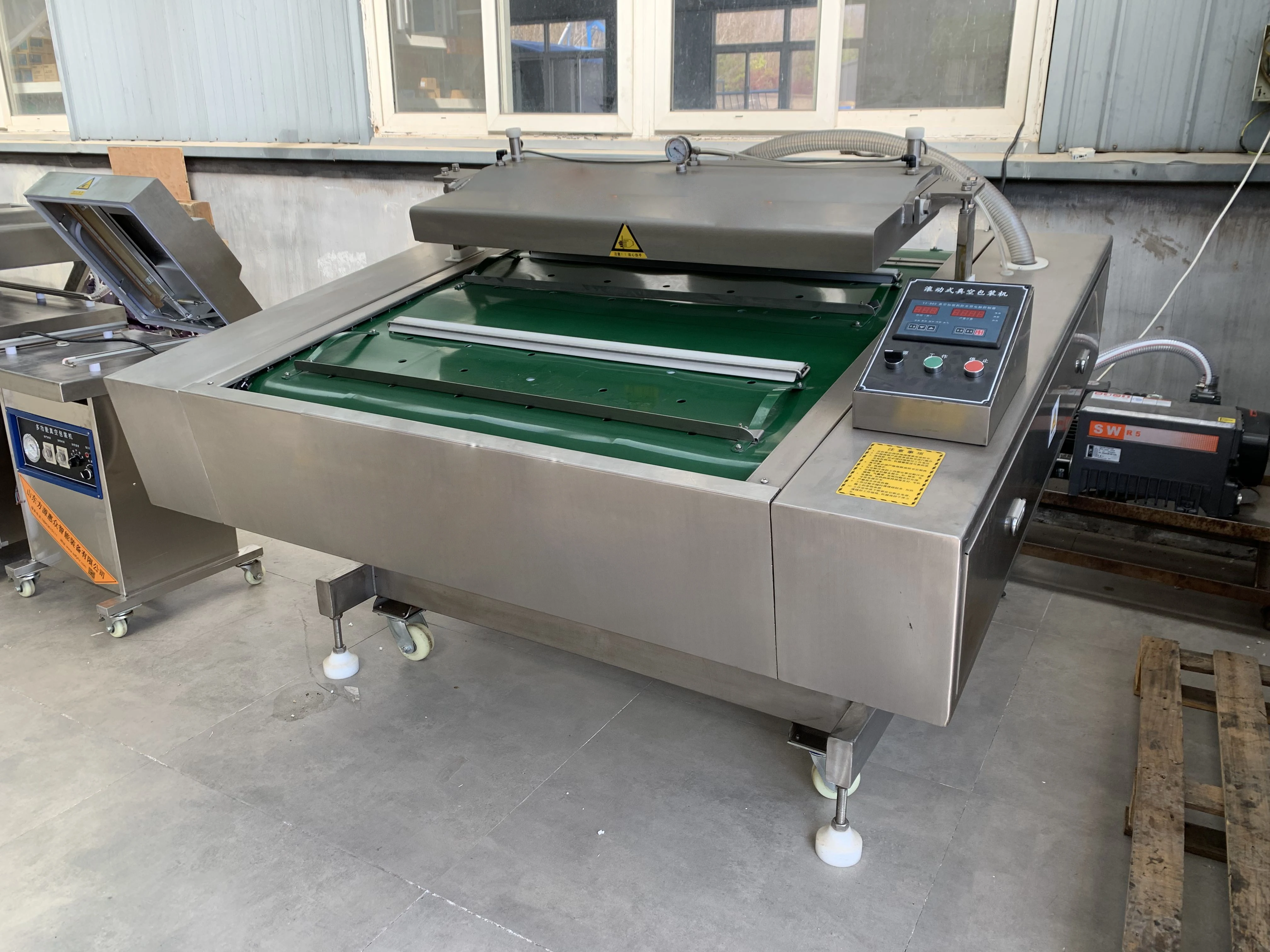 DZ-1000 automatic packing food rolling belt type rolling vacuum packaging machine