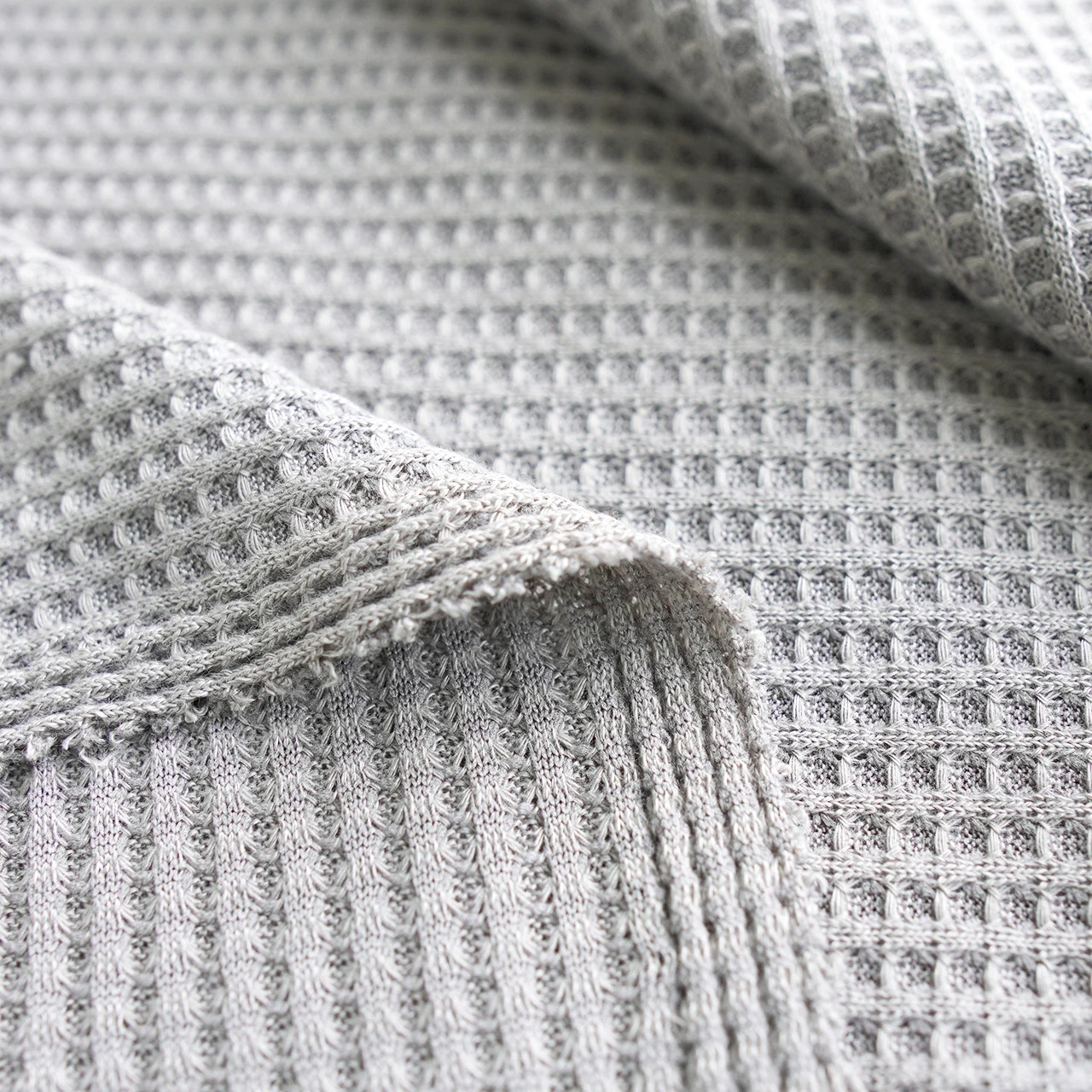 Factory direct sales of coarse needle Waffle plaid elastic fabric, soft and breathable spring and summer clothing fabric