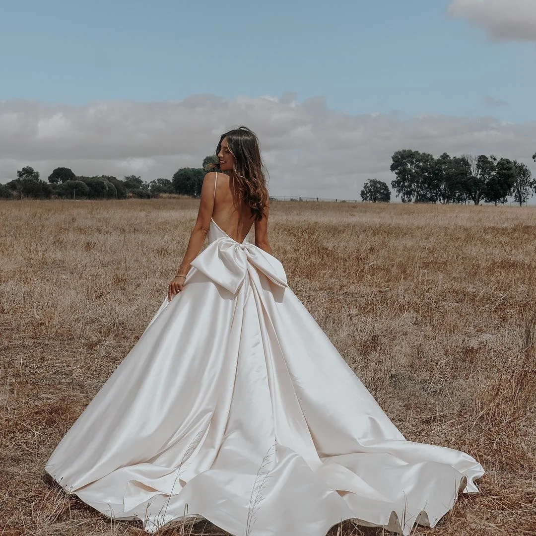 Ruolai WTH001 Elegant Blush Pink Spaghetti Strap Satin Mermaid Bridal Wedding Dress Draped with Bow Wedding Princess Gown