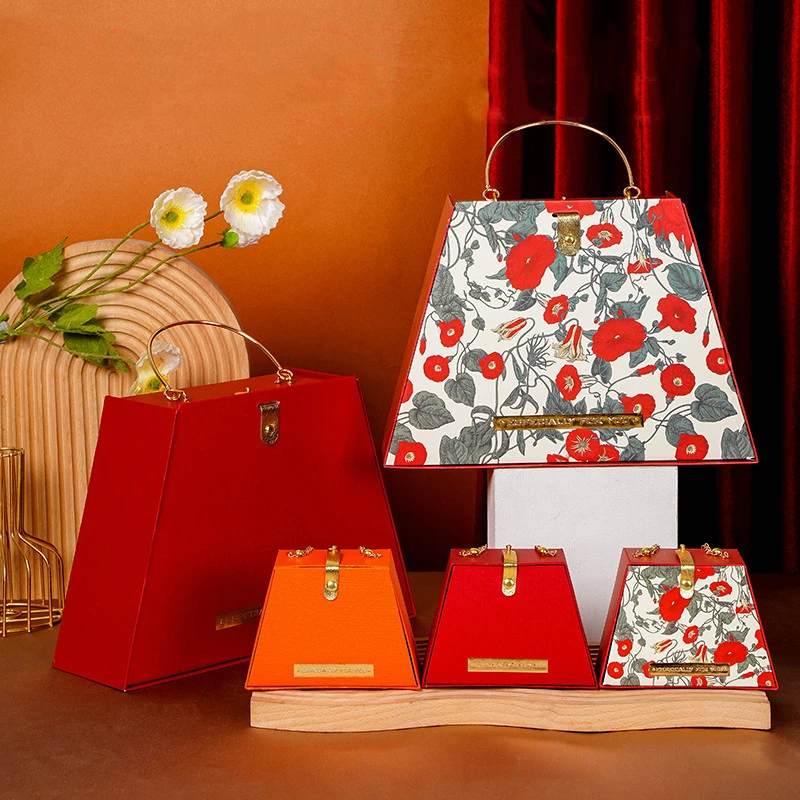Luxury trapezoidal handbag shape gift box red paper cardboard cosmetic makeup gift set box bag packaging with metal chain handle
