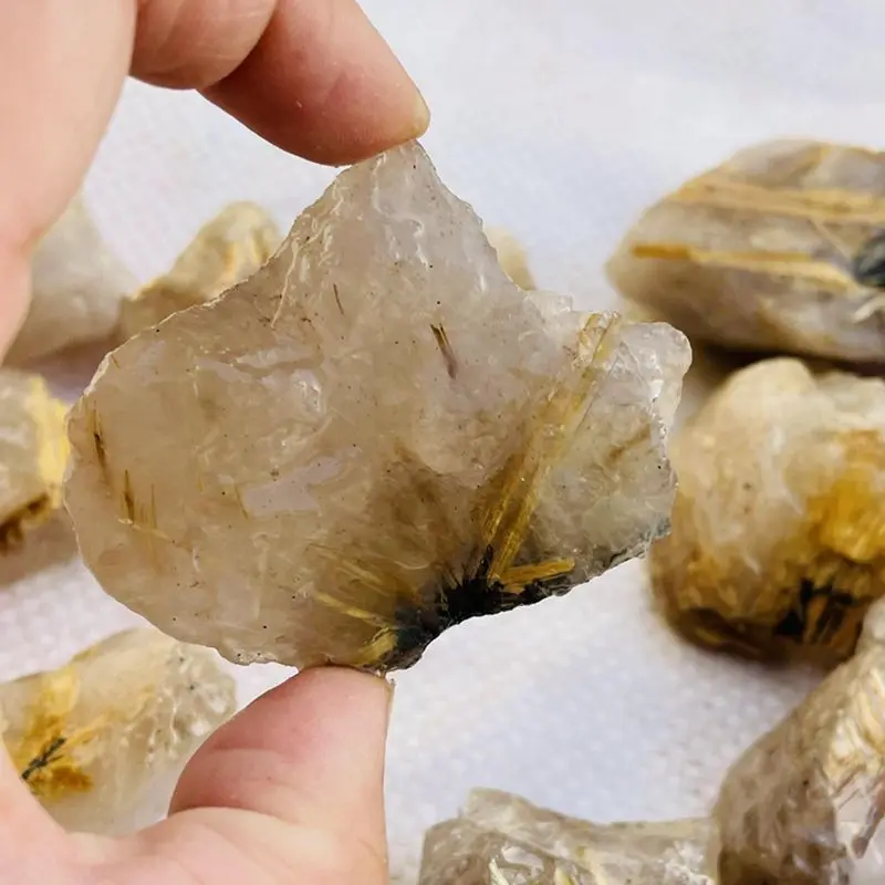 Редкий оптовая продажа натуральные золотые волосы рутилированные кварцевые необработанные кристаллы необработанный турмалиновый камень для продажи