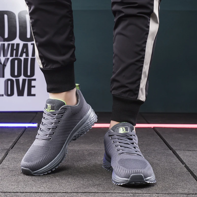 Factory Direct Sale  black larger size lace up strap rope material knit tennis mesh pure solid color black runner sneaker shoes