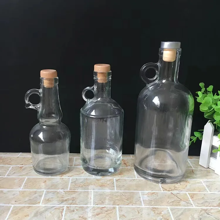 Customization service 750 ml glass vodka whiskey bottles sturdy base bottle for distilled beverages with handle cork caps