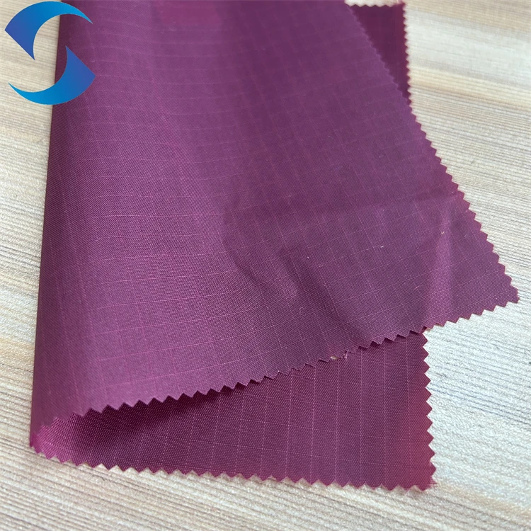 best selling 70D*210T ripstop semi dull 100% nylon fabric textile raw material Stretch Twill Coated nylon fabric supplier