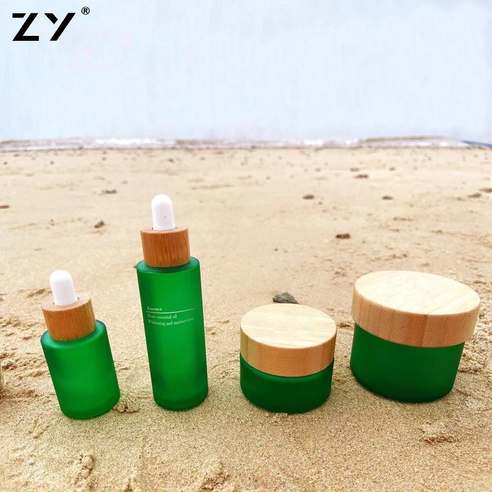 China 100ml 2oz 8oz 200g Custom Green Matte Colored Sample Premium Cream Frosted Glass Cosmetic Jar Containers With Bamboo Lid