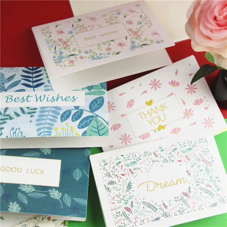 Customized flower thank-you cards with wild flowers, accompanied by envelopes. Floral blank greeting cards