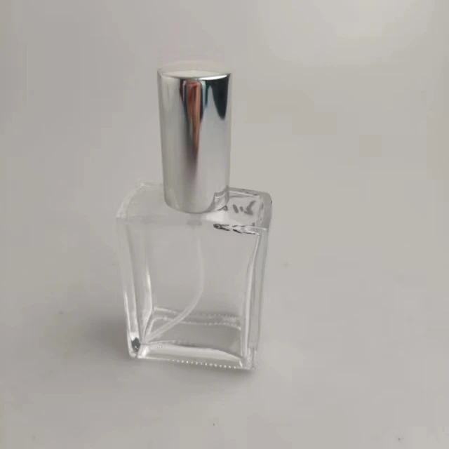 100ml perfume spray bottles cosmetic glass container transparent body and silver lid