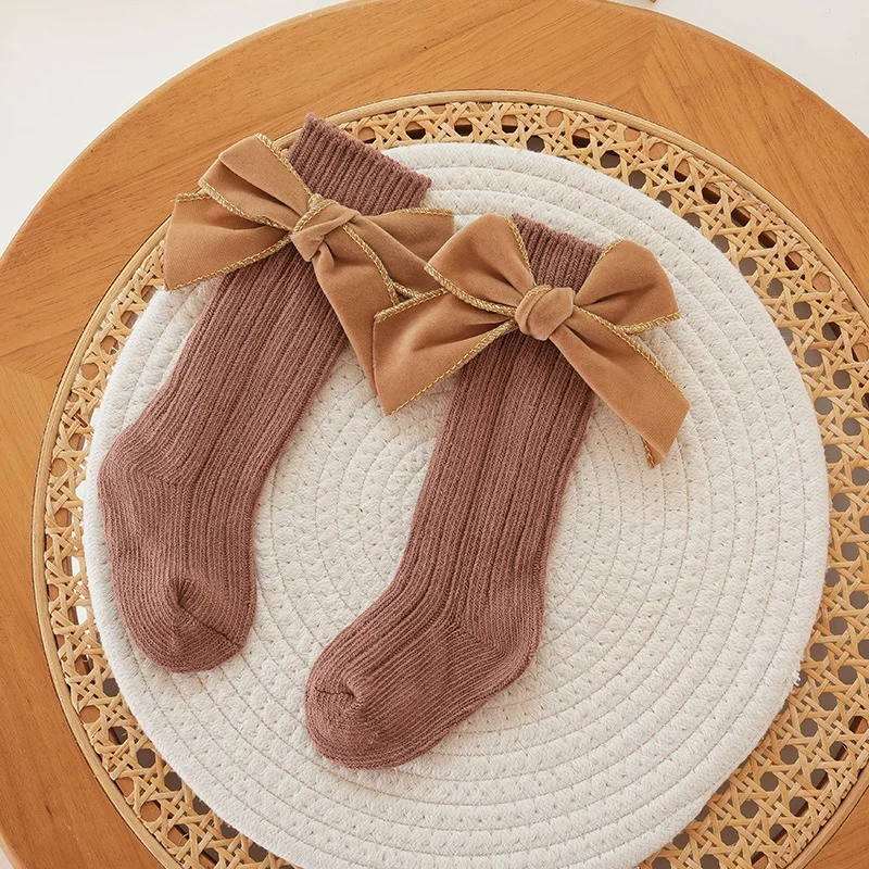 Autumn and winter baby girl fashion thick needle cotton socks solid color sweet bow princess style high socks