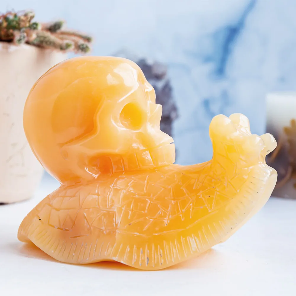 Wholesale hand carved natural healing stone pretty animal orange calcite crystal snail skulls folk crafts for home decoration