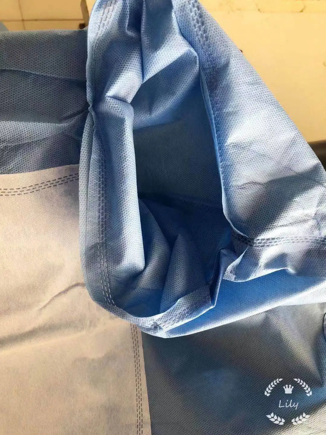 Surgical gown sewing machine