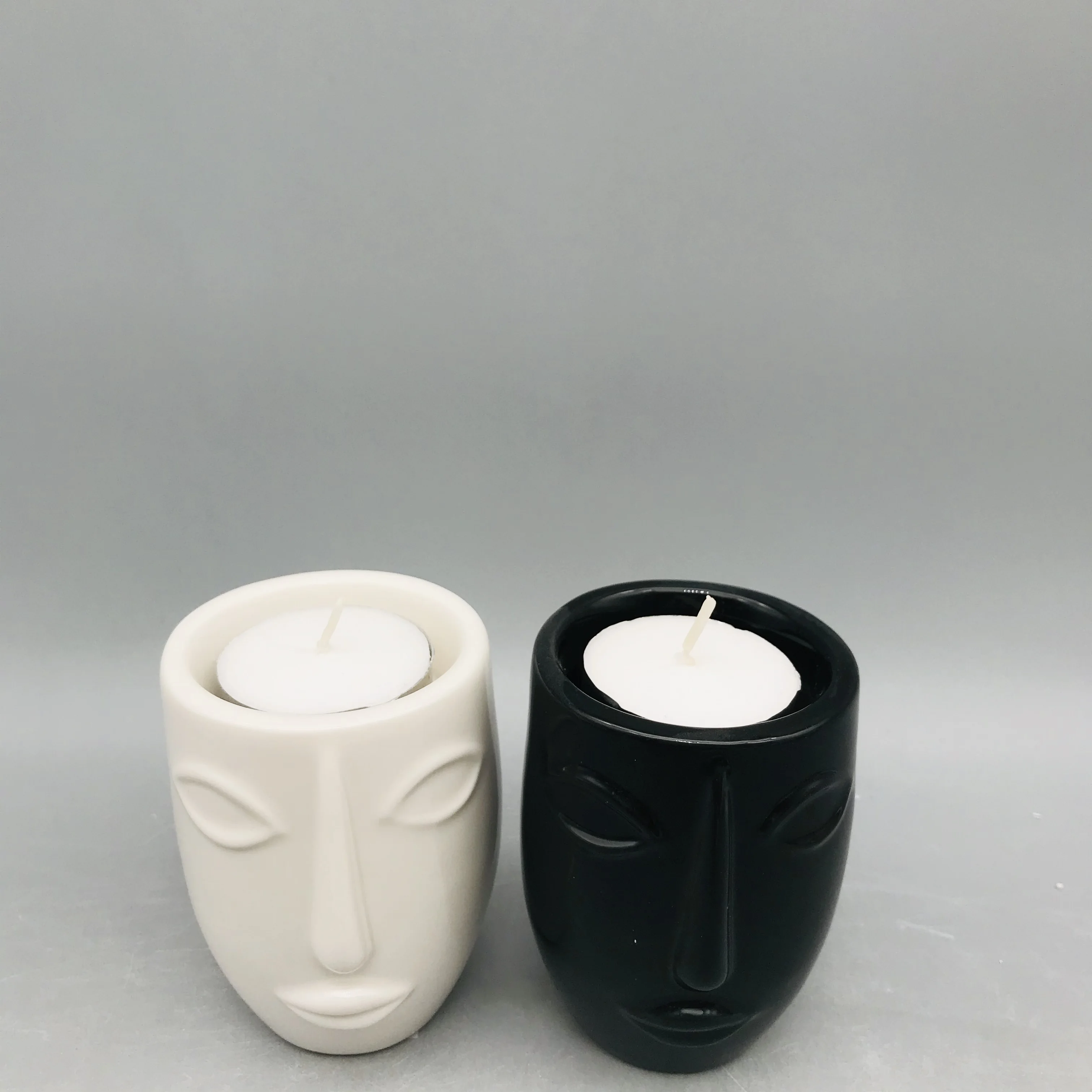
Customized black and white ceramic human face candle holder 