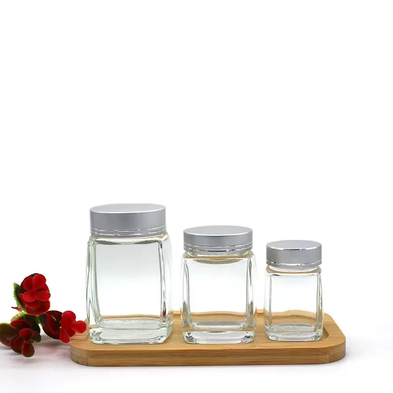 Wholesale square glass honey jar with screw metal lid glass bottle container