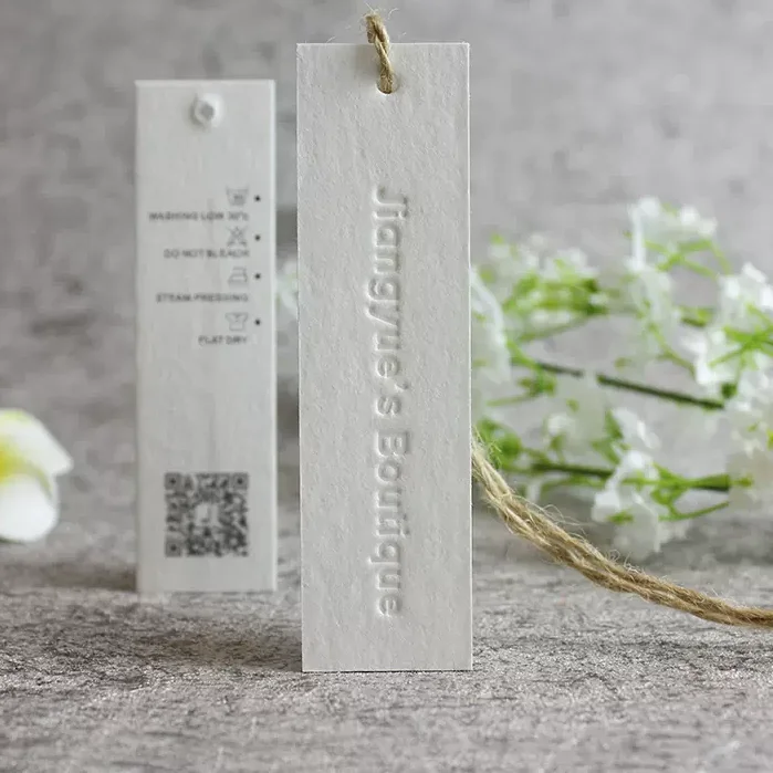Customized 600g texture cotton paper luxury  labels logo embossed hang tags for cloths