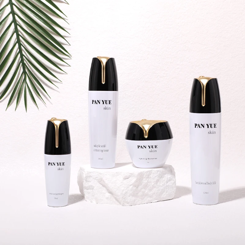 The latest lotus shaped empty glass bottle set with plastic plating lid for cosmetics skincare packaging wholesales