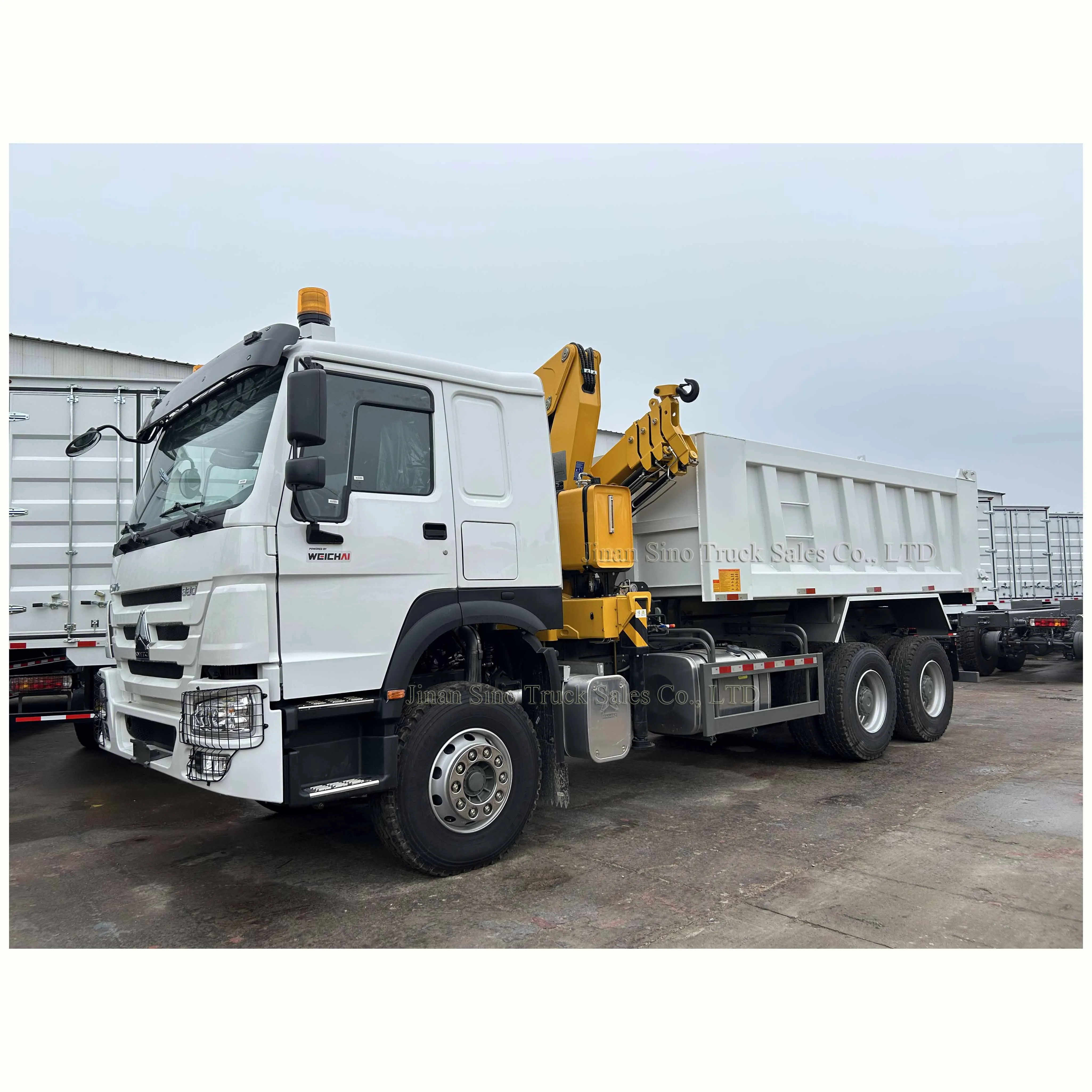 High lifting performance Sino Howo 25ton 10 wheeler Dump Truck mounted 5ton folding boom Crane