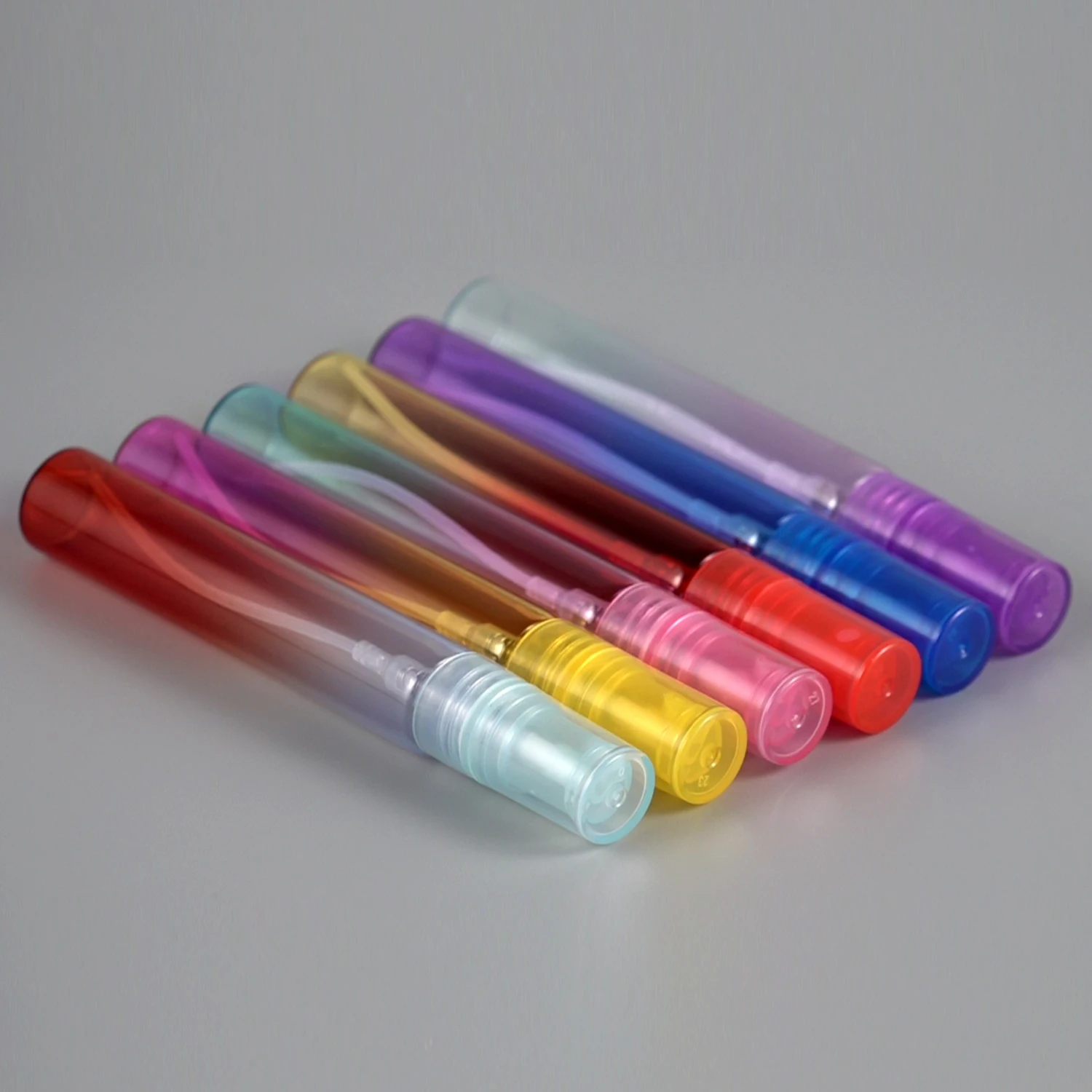 Low MOQ Sample Bottles Colorful Mist Spray Pump Empty Portable Mini 10ml 20ml Round Pen Pocket Perfume Bottle