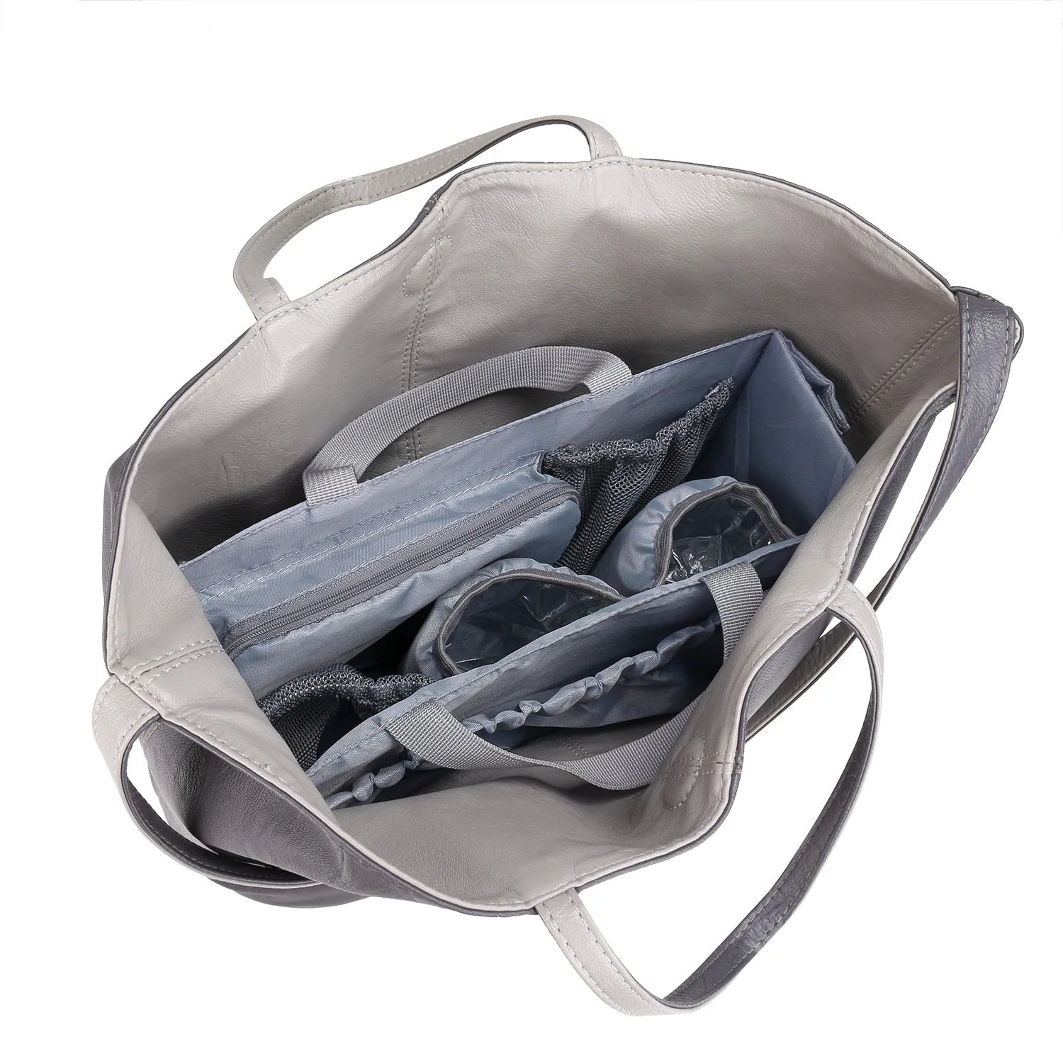 Detachable diaper bag liner with 6 total pockets, including an insulated pocket, keychain and washable changing pad.