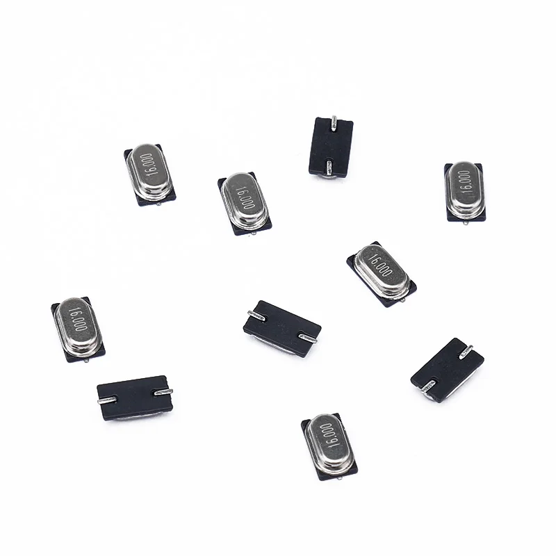 KCE quartz crystal oscillator SMD HC-49 US on a  wristwatch control circuit board