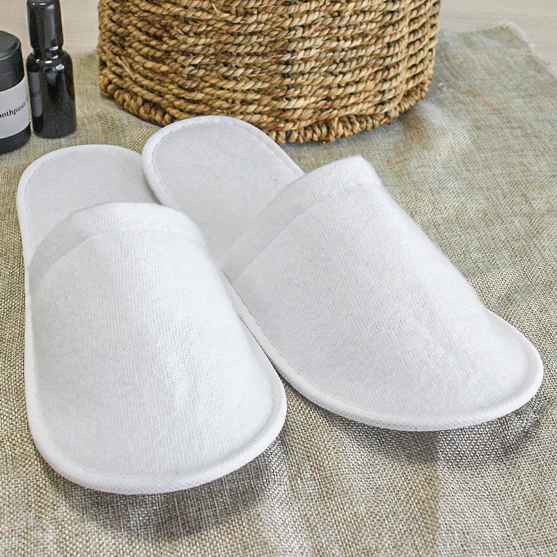 OEM логотип на заказ оптовая продажа дешевые одноразовые белые Тапочки для гостевой спальни спа хлопковые махровые велюровые тапочки подошве EVA отеля