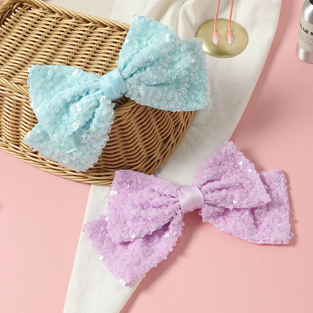 9 inch wide pastel lt blue purple sequin hair bow with French hair clip summer and spring with satin backside
