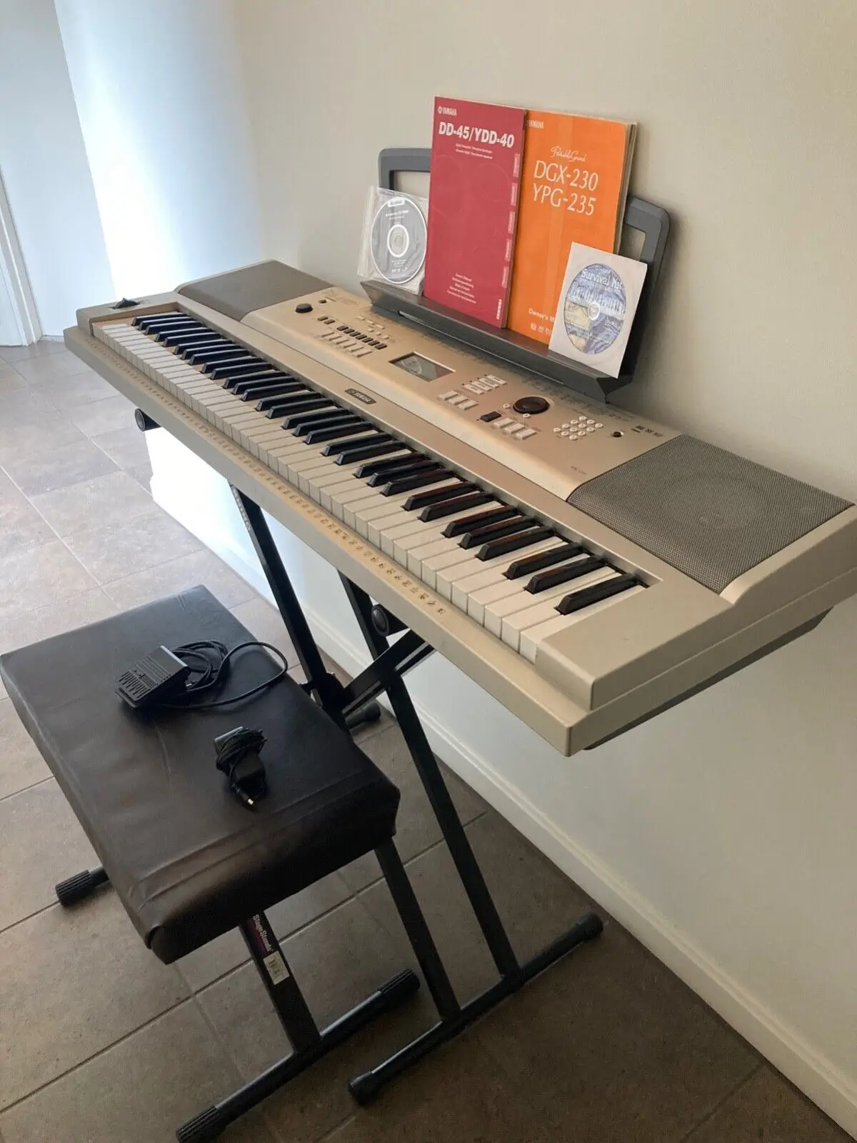 DGX230 YAMAHAs A wealth of realistic sounds dynamic styles and sophisticated music-making features Portable Grand