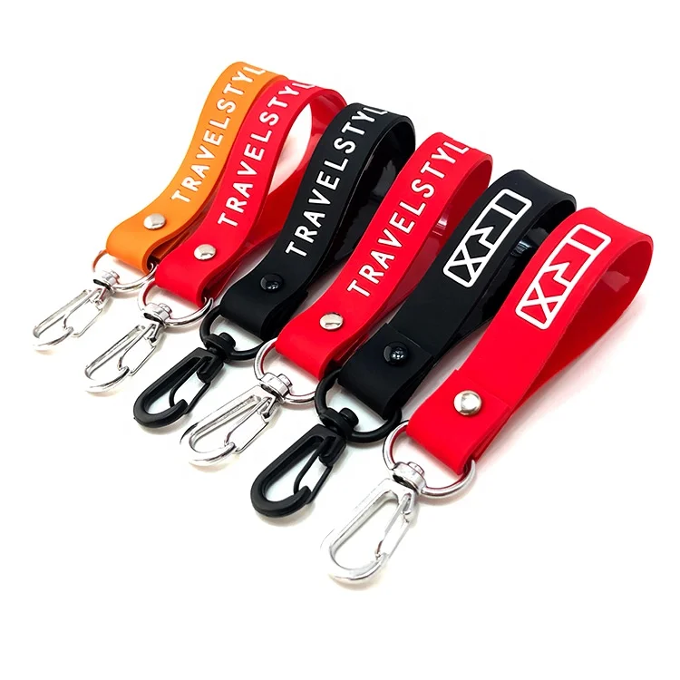 Hot sale black color tape and engraved logo 100% soft silicone wristband key chain